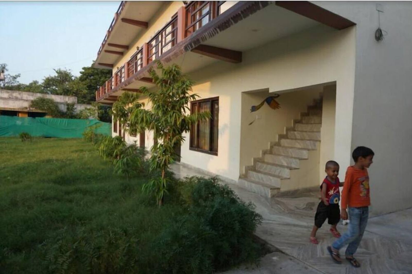 Hotel garden and two-storey rooms at Ramayana Khajuraho